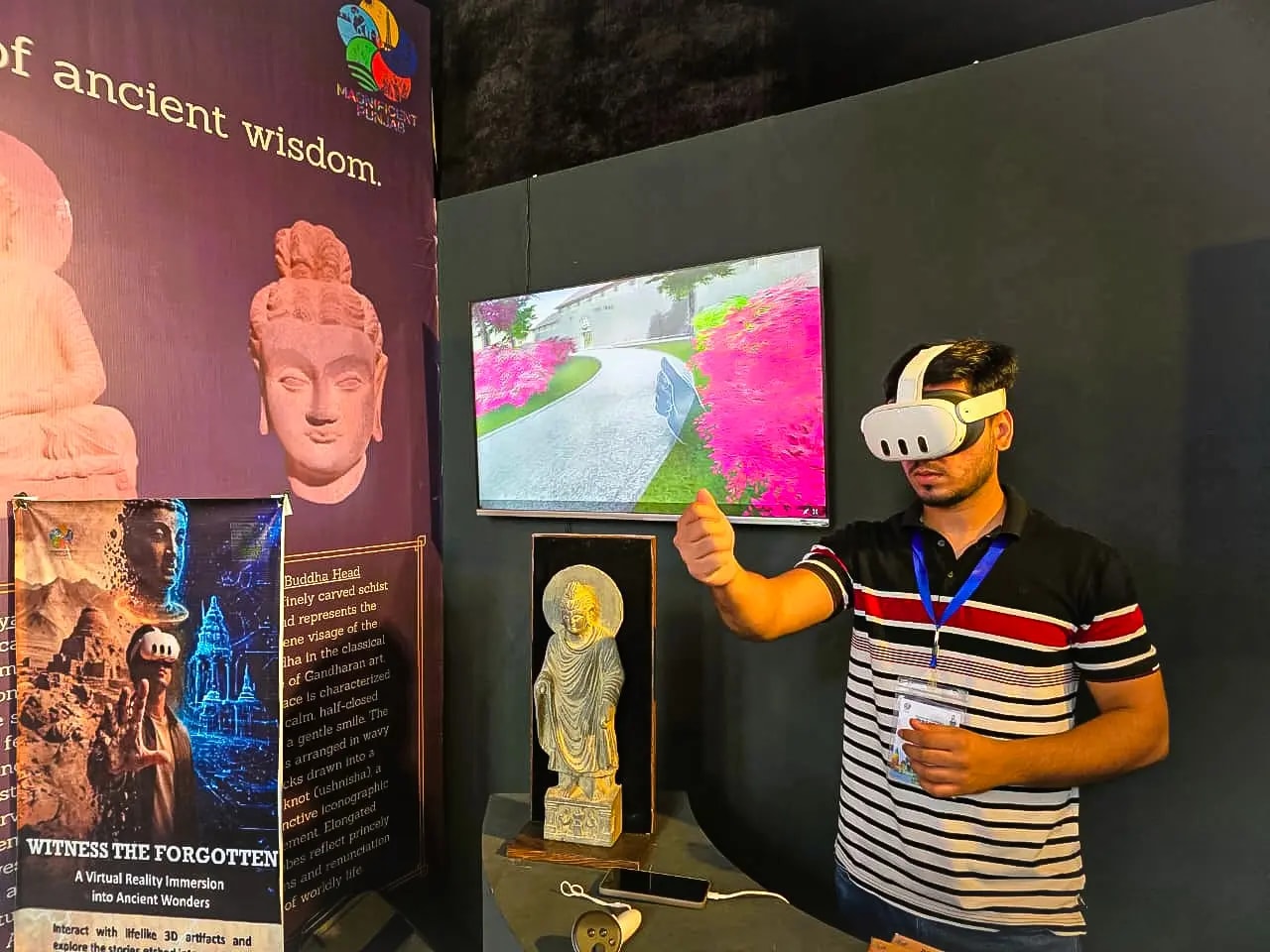 A team member trying a virtual-reality headset at a technology showcase booth